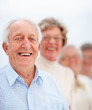Mature man in front of a group of older people