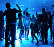 Silhouette of people dancing at a disco Silhouette of people dancing at a disco