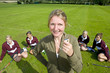 Portrait of smiling field hockey coach holding whistle