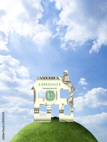 Photo: House made of one hundred dollar bill on hilltop House made of one hundred dollar bill on hilltop