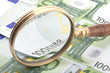 magnifying glass with money magnifying glass with money