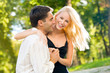 Young happy smiling couple walking outdoors together Young happy smiling couple walking outdoors together