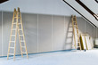 two ladders and wall