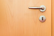 metal handle on wooden door