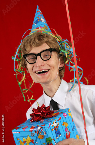 Photo: Cute party nerd with a gift Cute party nerd with a gift