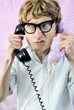 Funny nerd busy having a conversation on two phones