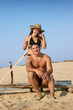 Portrait of a happy young couple enjoying on beach Portrait of a happy young couple enjoying on beach