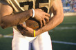 Close up of football player holding football