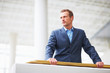 Young successful business man looking away.