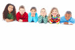 Six children lying down in a row over white background