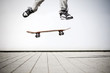 skater making an olli with his skateboard skater making an olli with his skateboard