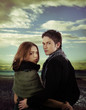 couple in love holding against dramatic sky couple in love holding against dramatic sky