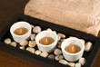3 tea lights with brown towel