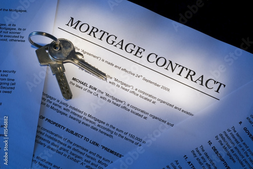 Photo: Mortgage contract with house keys Mortgage contract with house keys