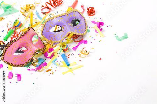Photo: carnival masks and colorful confetti on white carnival masks and colorful confetti on white