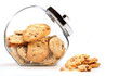 Glass jar with cookies against a white Glass jar with cookies against a white