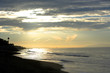 Sunrise over the beach with seagulls flying Sunrise over the beach with seagulls flying