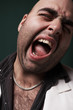 Photo: close up of angry man screaming close up of angry man screaming