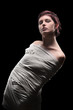 Young powerless woman isolated on black background