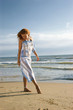 girl draws by a leg on sand girl draws by a leg on sand