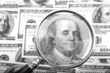 magnifier with money closeup magnifier with money closeup