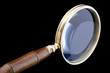 magnifying glass on black close up magnifying glass on black close up