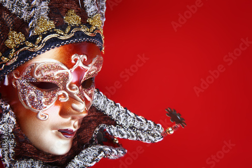 Photo: ornate carnival mask over textured metallic background ornate carnival mask over textured metallic background