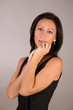 Photo: Beautiful woman on gray background Beautiful woman on gray background
