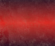 Stained, painted red metal with rust