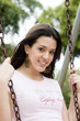 Pretty girl swinging in the park Pretty girl swinging in the park