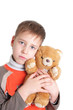 sad boy with a soft toy