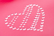 Red heart shape made of water droplets