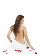 beautiful girl with a towel, and around petals of roses beautiful girl with a towel, and around petals of roses