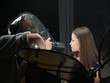 Female photographer shooting close up model's lips in studio Female photographer shooting close up model's lips in studio
