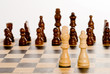 Chess on white - lonely white king and queen against blacks