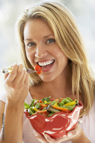 Young Woman Eating Fresh Salad Young Woman Eating Fresh Salad