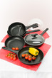 Still-life with fry pans and vegetables