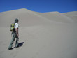 Man hiking in sand dunes