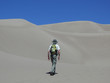 Man hiking in sand dunes