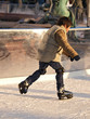 child learning  ice skating