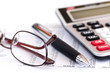 Tax calculator pen and glasses Tax calculator pen and glasses