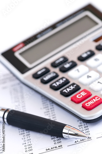 Photo: Tax calculator and pen Tax calculator and pen