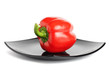Red pepper on a black plate