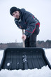 Photo: Boy with shovel. Boy with shovel.
