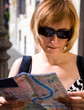 Lovely woman with map of city