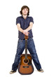 man holding his acoustic guitar between legs man holding his acoustic guitar between legs