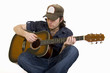man playing his acoustic guitar seated man playing his acoustic guitar seated