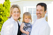 Family in Front of House