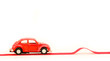 Red toy car heading for a bump Red toy car heading for a bump