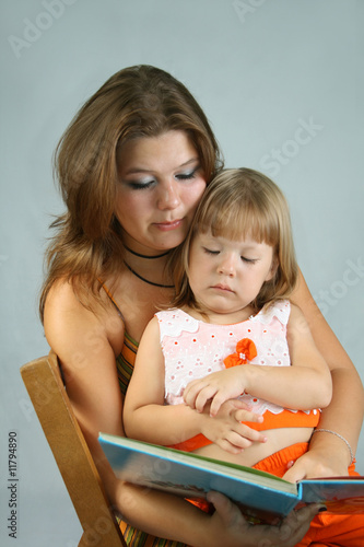Photo: Two sisters read the book Two sisters read the book